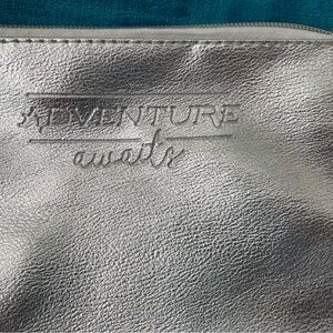 “Adventure Awaits” Silver Shimmer NWOT Cosmetic Faux Leather Bag for Women